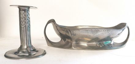 An Archibald Knox Tudric  Liberty Style pewter candle stick, with fixed sconce. with a pierced