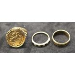 Three hallmarked 9ct gold rings. A 9ct gold St George medallion ring, in as found condition; a 9ct