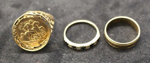 Three hallmarked 9ct gold rings. A 9ct gold St George medallion ring, in as found condition; a 9ct