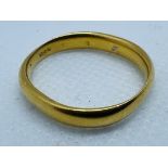 A 22ct gold band ring with rubbed hallmarks. In as found condition. Approximate weight 6.3 grams.