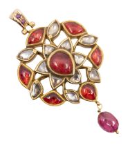 An Indian Kundan pendant set with Polki diamonds, fancy shaped garnet cabochons, small faceted