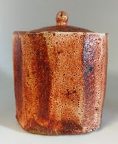 Lisa Hammond (born 1956). Stoneware lidded tea caddy. with orange and brown glaze decoration.