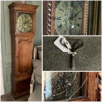 A reproduction longcase clock in an oak case with 3 train associated Westminster chimes movement,