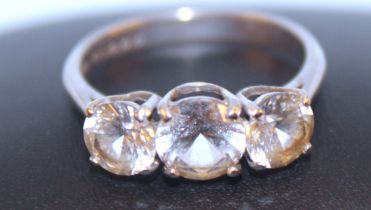 18ct White Gold three stone white sapphire ring. Ring size O. Centre stone is approx 1.00ct and