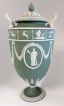 A large Wedgwood 19th C lidded Signs of the Zodiac trophy vase in sage green. The body applied