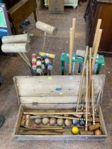 Good collection of Croquet mallets, balls and Hoops. Everything you need except the rules !  3