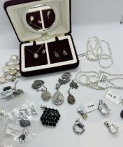 A collection of 925 silver jewellery to include three diamond set pendants and a number of brand new
