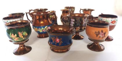 A large collection of mid Victorian copper lustre to include goblets, jugs and creamers , some sprig