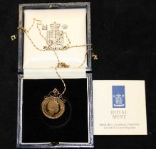 A 1988 Elizabeth II half sovereign in a 9ct gold clip mount, with a 9ct gold chain.