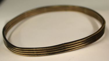 9ct Yellow Gold four bar bangle.  Hallmarked 9CT for 9ct Gold.  Weight: 17.63 grams.  There is