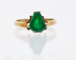 ***AUCTIONEER TO ANNOUNCE REVISED HIGHER  ESTIMATE**** An emerald and 18ct gold ring, comprising a