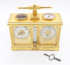 A late Victorian combined carriage clock, aneroid barometer, thermometer and compass in gilt brass