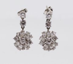 A pair of diamond and white gold drop earrings, comprising a cluster drop, claw set with marquise,