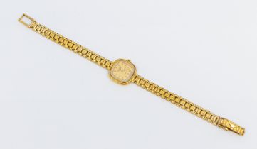 Longines- a ladies 9ct gold Longines quartz wristwatch, comprising a signed cushion shaped cream