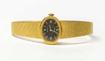 Rolex- a ladies 18ct gold Rolex wristwatch, comprising a signed black oval dial with applied gilt