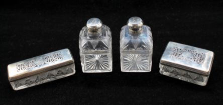 A pair of probably 19th century cut glass spirit flasks having unmarked white metal probably