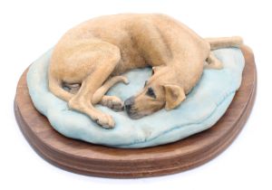 Elizabeth Waugh (1929-2023) Great Dane curled up on a bed  resin signed E Waugh S.P.H to side,