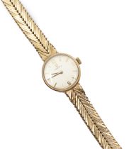 Omega- a ladies vintage 9ct gold Omega wristwatch, comprising a round silvered signed dial, with