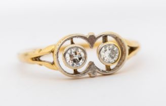 An Edwardian diamond and 18ct gold ring, comprising two old European cut diamonds, total diamond