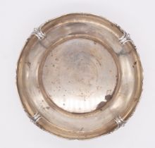 A George V silver bowl, with four turned scroll handles, with wavy beaded rim, plain body,