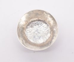 An Arts & Crafts style 999 standard silver planished miniature bowl, stamped AG in script, 999 and