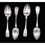 A set of four William IV Irish silver fiddle pattern table spoons, each engraved with a crest