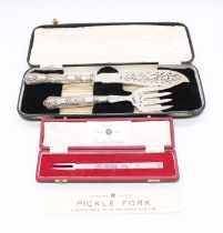 A Victorian cased fish serving knife and fork set, having pierced and engraved leaf and foliage