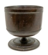 A Charles II Lignum Vitae Wassail cup / bowl, circa 1685, with ring decoration on squat waisted stem