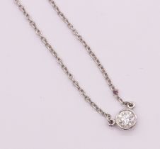 Tiffany & Co- a Diamonds by the Yard, single brilliant cut diamond  platinum necklet by Elsa Peretti
