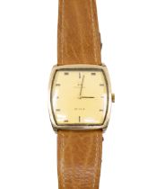 Omega- a gentleman's 9ct gold Omega De Ville wristwatch, comprising a cushioned shaped signed gilt