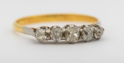 A diamond and 18ct ring, comprising five graduated old European cut diamonds, claw set in platinum