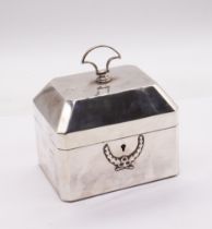 A George V silver cigarette box / tea caddy, plain body with canted corners, the domed cover with