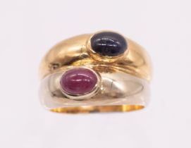 A sapphire and ruby two tone 18ct gold dress ring, comprising an 18ct white gold band set with an