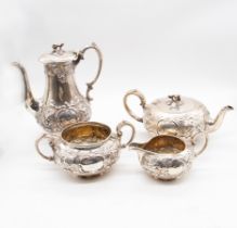A Victorian silver four piece tea and coffee service consisting of tall coffee pot, sphere shaped