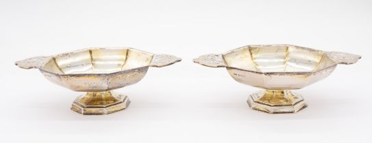 A pair of George VI silver gilt octagonal two handled bon bon dishes / salts, pierced handles, on