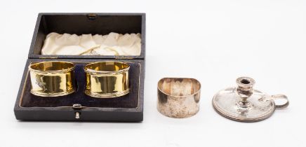 A group of silver to include: a pair of George VI silver gilt napkin rings, with reed and ribbon