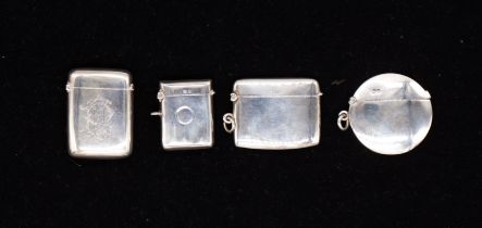 A group of four late 19th Century/early 20th Century plain silver vesta cases, one engraved with