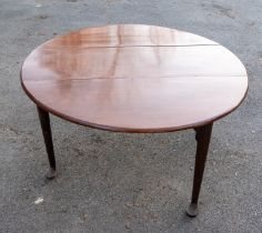 An 18th Century Georgian mahogany gate leg drop leaf table, oval top on tapered legs with pad