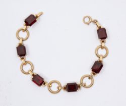 A garnet set 9ct gold bracelet, comprising rectangular claw set mixed cut garnets, approx 7 x 9mm,