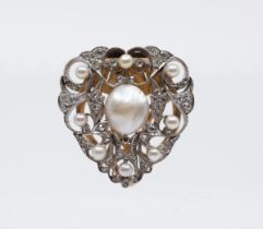 An Edwardian diamond and pearl gold clip, comprising a heart shaped form set to the centre with a
