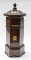 A 19th Century wooden post box with brass fittings and hand carved acanthus leaves, pommel top
