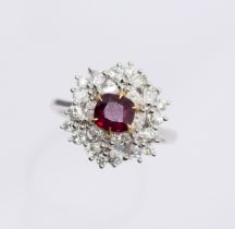 A Burmese ruby and diamond 18ct white gold cluster ring, comprising a cushion cut ruby approx 1.