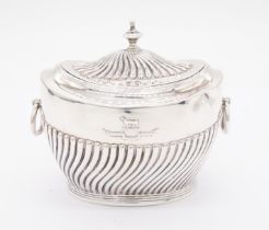 An Edwardian silver sugar box and cover, gadrooned body and oval gadrooned hinged cover, finial to