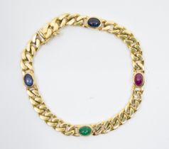 An 18ct gold sapphire, ruby, emerald set bracelet, comprising oval cabochon sapphires, an emerald