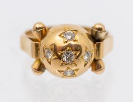 An early 20th century diamond star set dress ring, comprising a domed diamond set mount, within