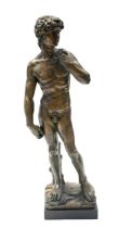 After Michelangelo (1475-1564) a patinated plaster cast model of David, stamped DAVID to front,