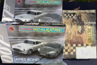 Scalextric: A collection of three boxed Scalextric sets, two James Bond 007 Micro Scalextric sets