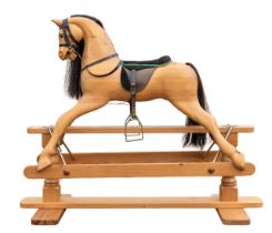 Rocking Horse: A late-20th century rocking horse, of wooden construction. Unpainted and unmarked.