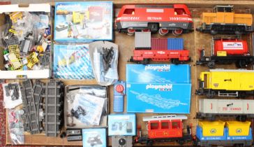 Playmobil: A collection of assorted unboxed Playmobil RC Trains and rolling stock comprising two