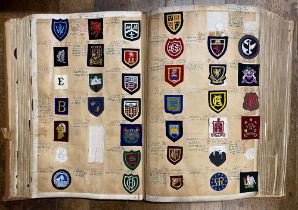 Heraldry. Embroidered crest catalogues, 1938-1968, in five large folio volumes measuring 59cm in
